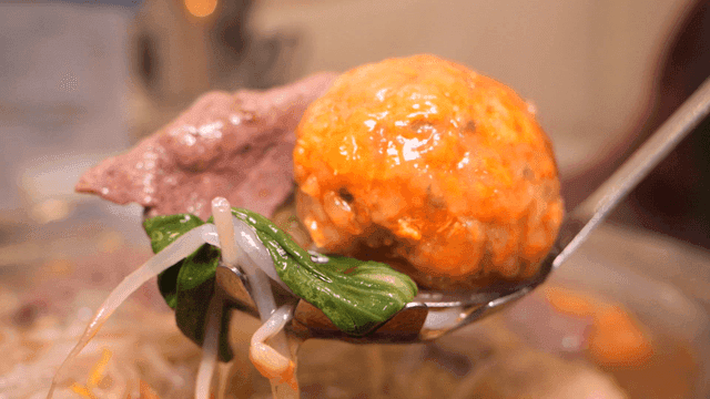 Rolled dumpling hot pot scooped out with ladle