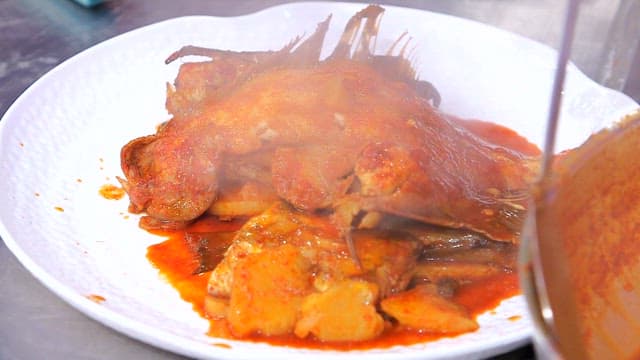 Spicy assorted braised fish served on a plate