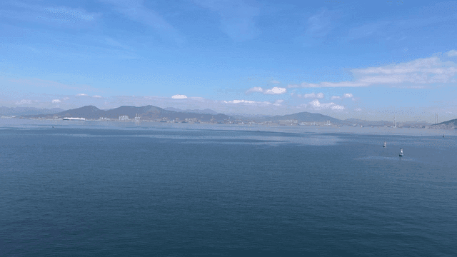 Vast sea with mountains visible in distance