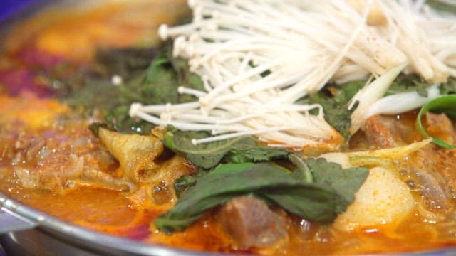 Napa cabbage and pork backbone stew with fresh vegetables