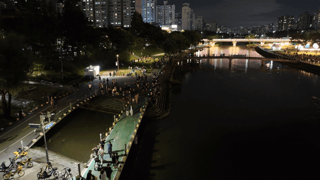 Night festival by the riverside in the city