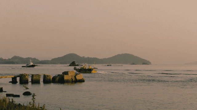Ships on calm sea in evening sea