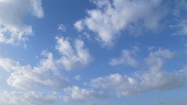 Serene Mudflats Landscape with Blue Skies and Clouds