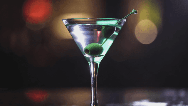 Martini glass with olive.
