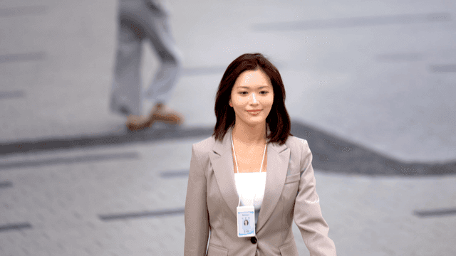 Working woman walking confidently down street