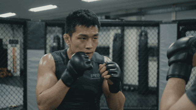 Man practicing boxing at gym