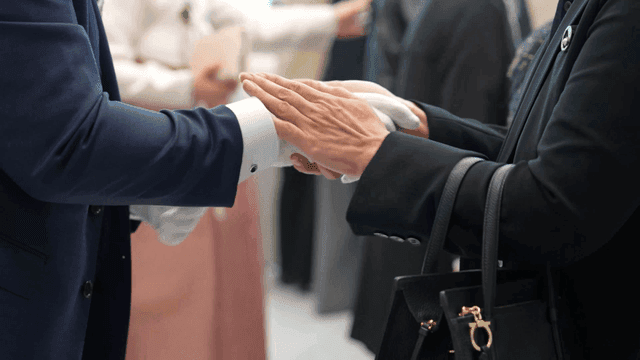 Groom welcoming guests