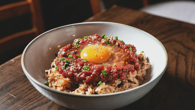 Beef tartare bibimbap topped with egg yolk