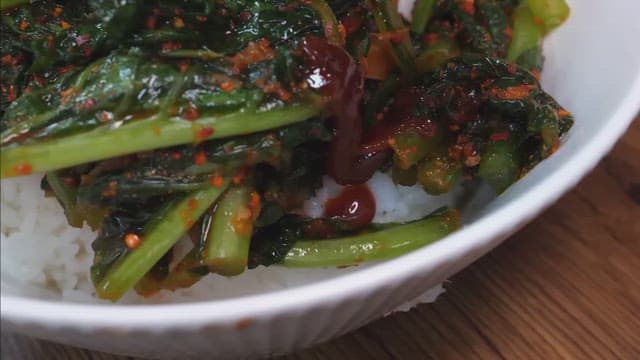 Preparing bibimbap with gochujang and vegetables