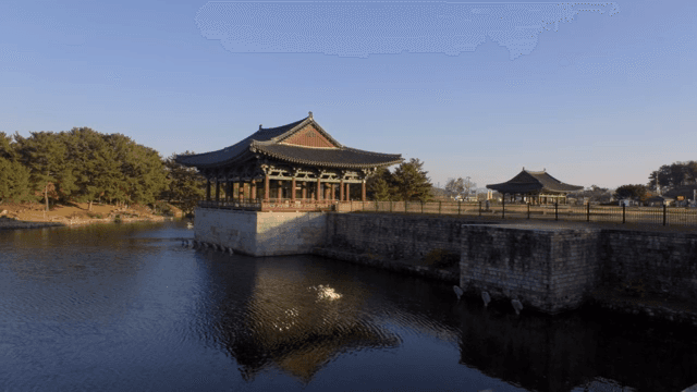 Traditional Korean pavilion by a serene pond