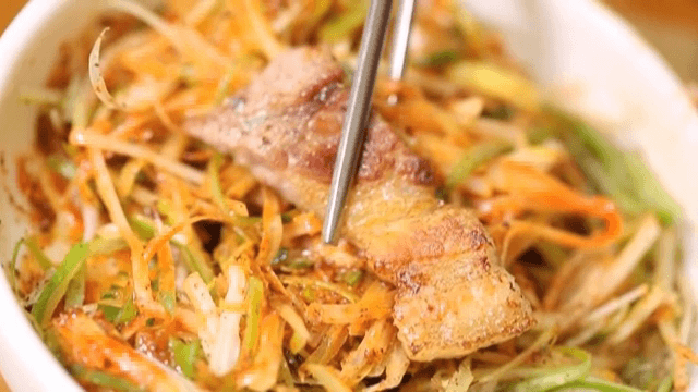 Picking up pork with Green Onion Salad