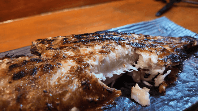 Grilled fish eaten with chopsticks
