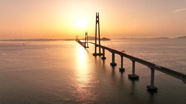 Bridge stretching over the sea at sunset