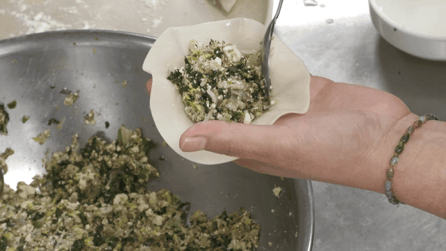 Person who puts filling into dumpling wrapper
