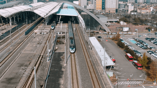 Train station with multiple tracks and trains.