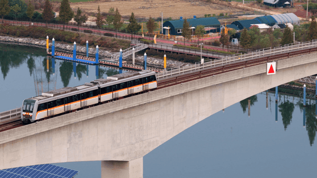 Train crossing a bridge over a river