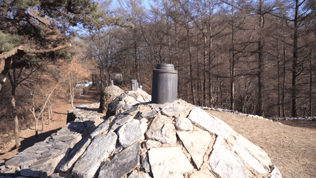 Stone beacon tower in forest