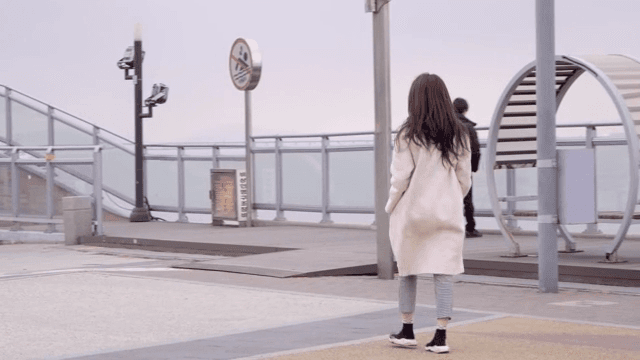 People walking on a seaside promenade