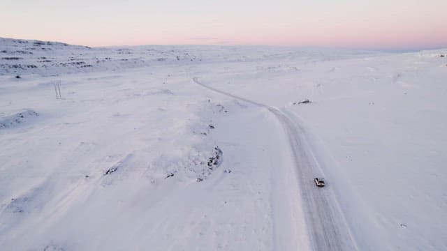 Car traveling on a snowy road