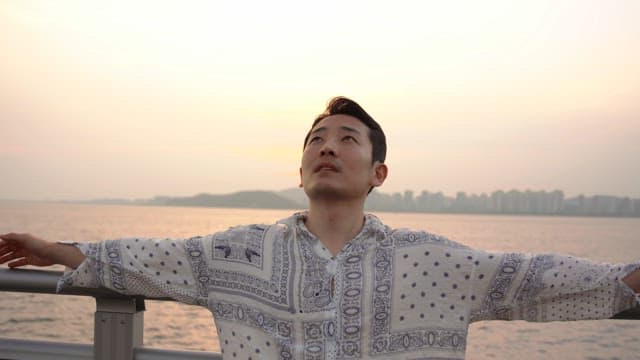 Man enjoying the sunset by the seaside