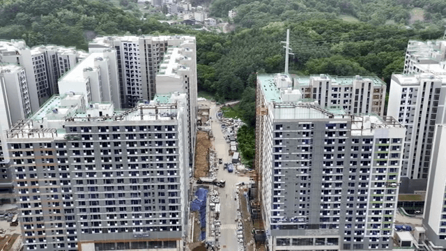 High-rise buildings surrounded by forest