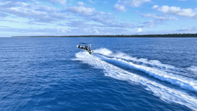 A boat speeding across the ocean