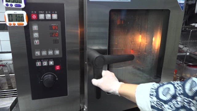 Lobster being cooked inside a oven in a kitchen