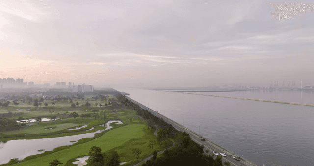 Serene landscape with a golf course and river
