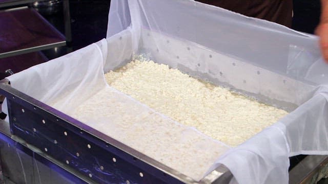 Tofu being prepared in a kitchen