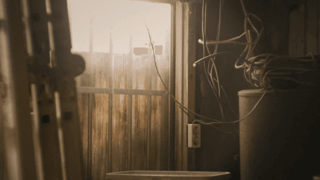 Dark room with tangled power cords lit by sunlight