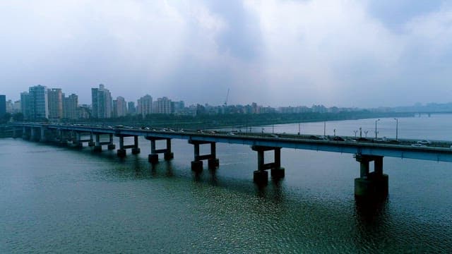 Bridge over the Han River with Cars on a Cloudy Day