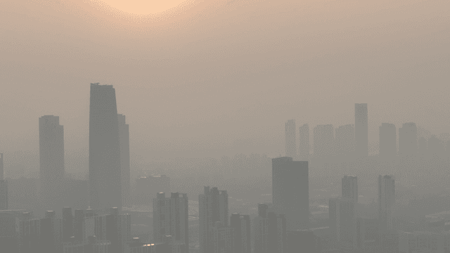 City skyline with hazy sunset