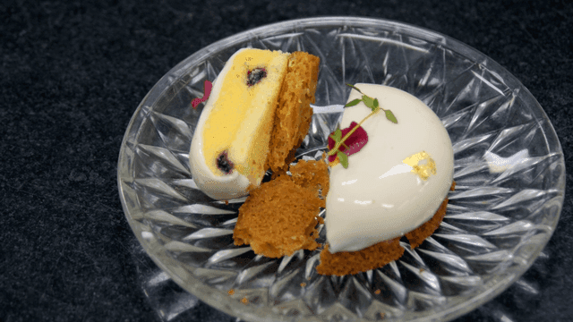 Elegant dessert with gold leaf on a plate