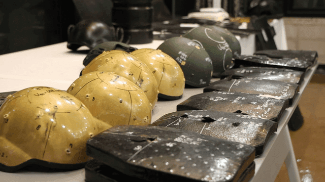 Military helmets and armor on display