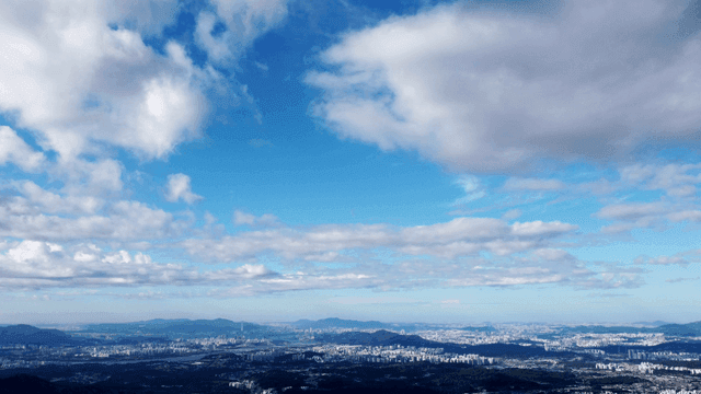Vast city landscape under cloudy sky