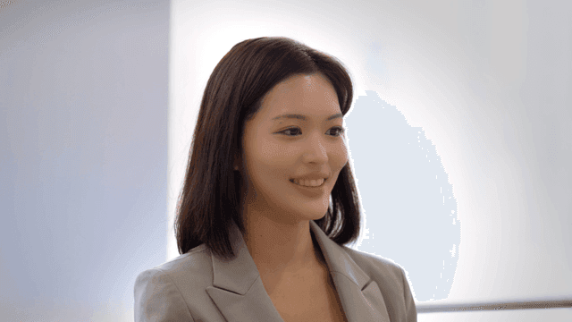 Female office worker in suit speaking