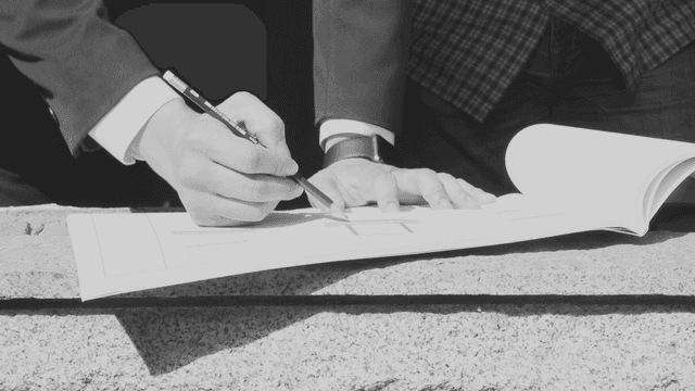 Person reviewing architectural plans