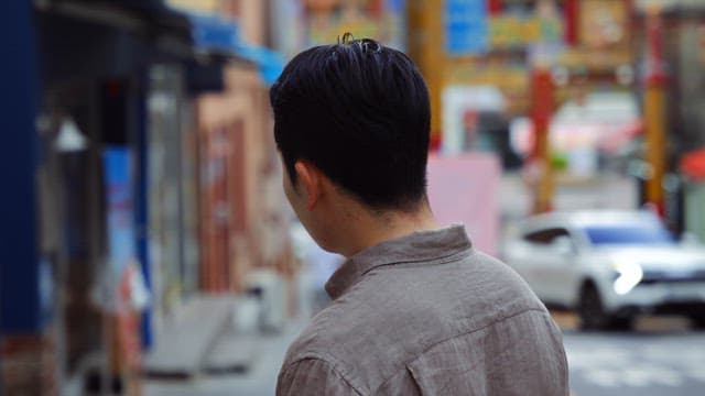 Man walking on a busy city street