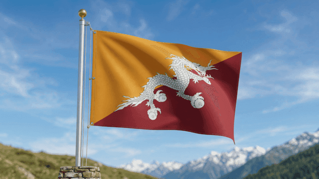 Flag of Kingdom of Bhutan fluttering amidst mountainous landscape