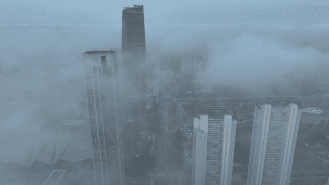 Skyscrapers shrouded in morning fog