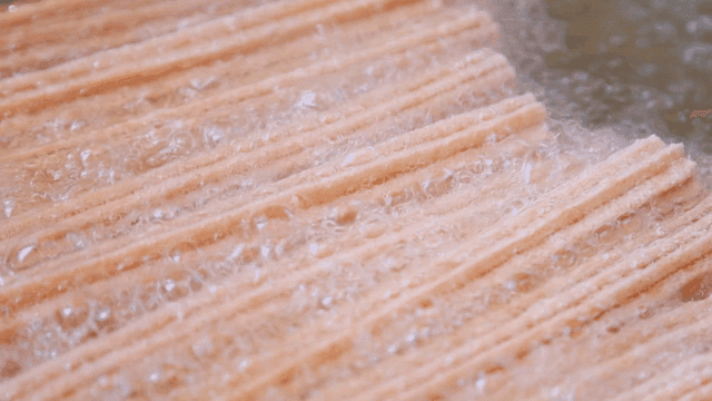 Churros frying in hot oil