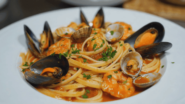 Plate of seafood pasta with mussels and shrimp