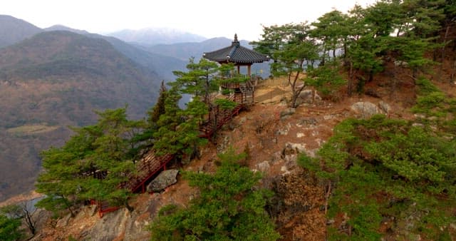 Traditional Pavilion Perched on a Cliffside