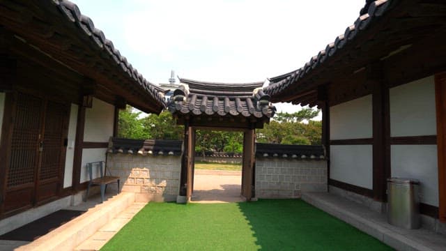 Traditional Korean gate leading to a garden