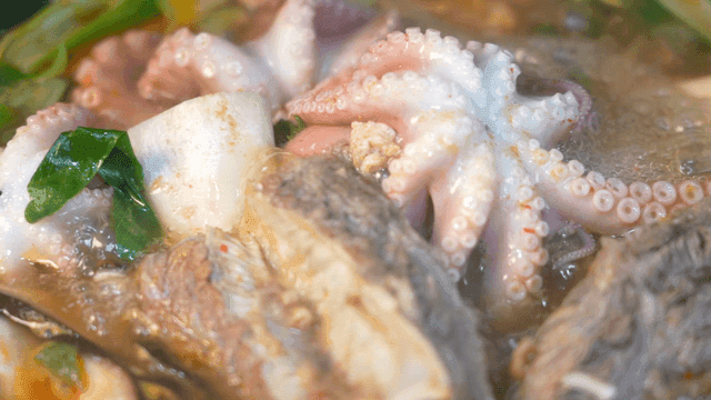 Hearty live octopus and short rib hot pot boiling