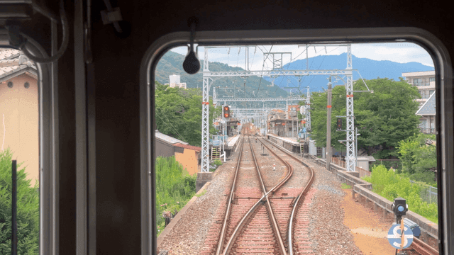 View from inside a train approaching a station