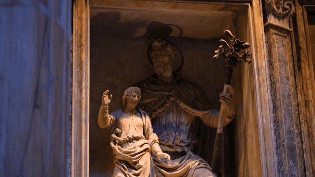 Statues inside dark cathedral