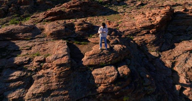 Person standing on rocky mountain