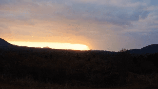 Sunset behind a mountain landscape