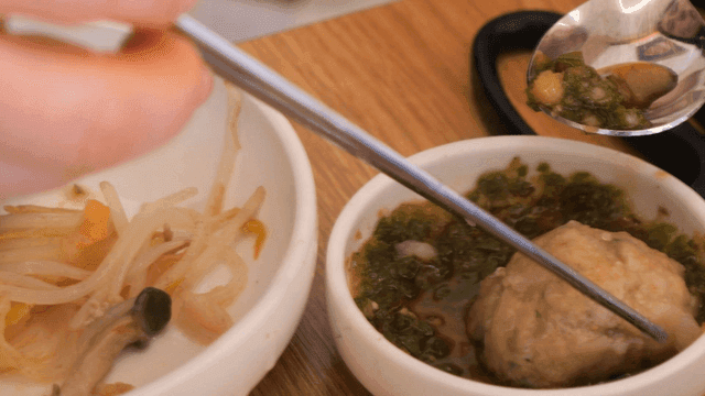 Rolled dumplings dipped in soy sauce